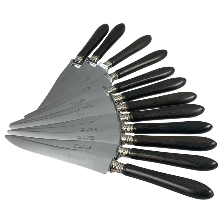12 table knives with ebony handles and pearl decoration