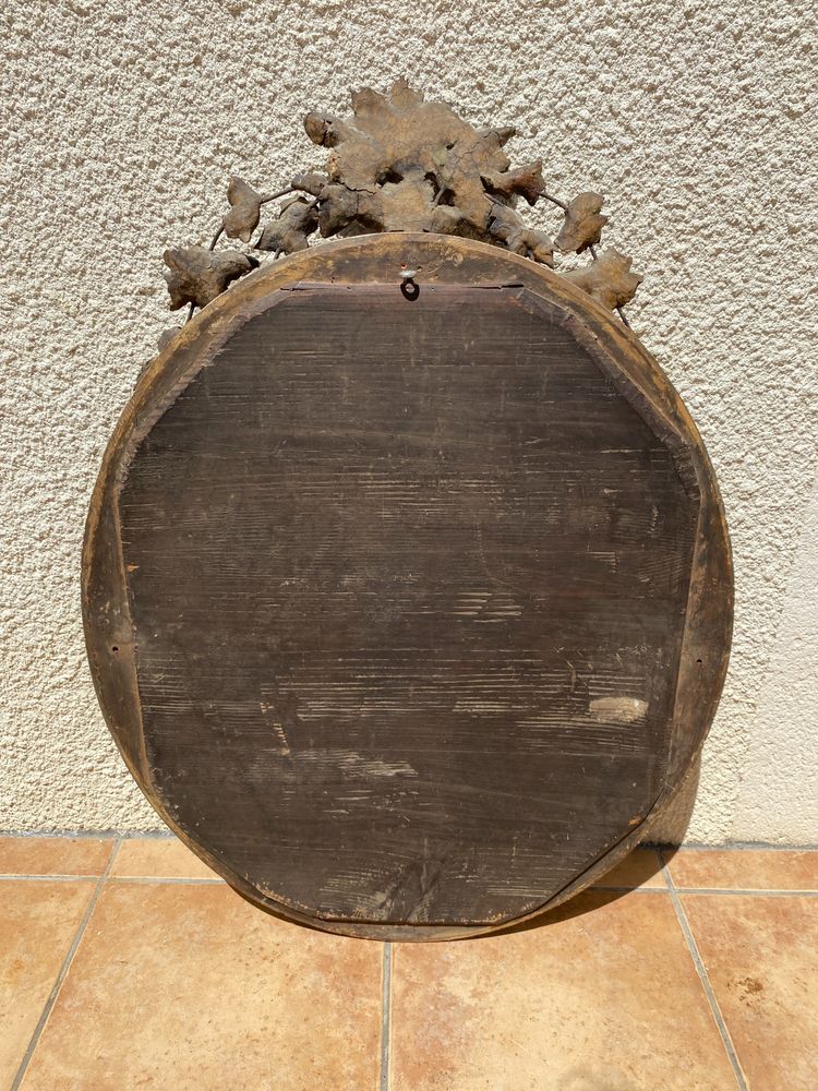 Miroir ovale à fronton fleuri en bois doré sculpté, époque Napoléon III – XIXᵉ siècle - 65x96 cm