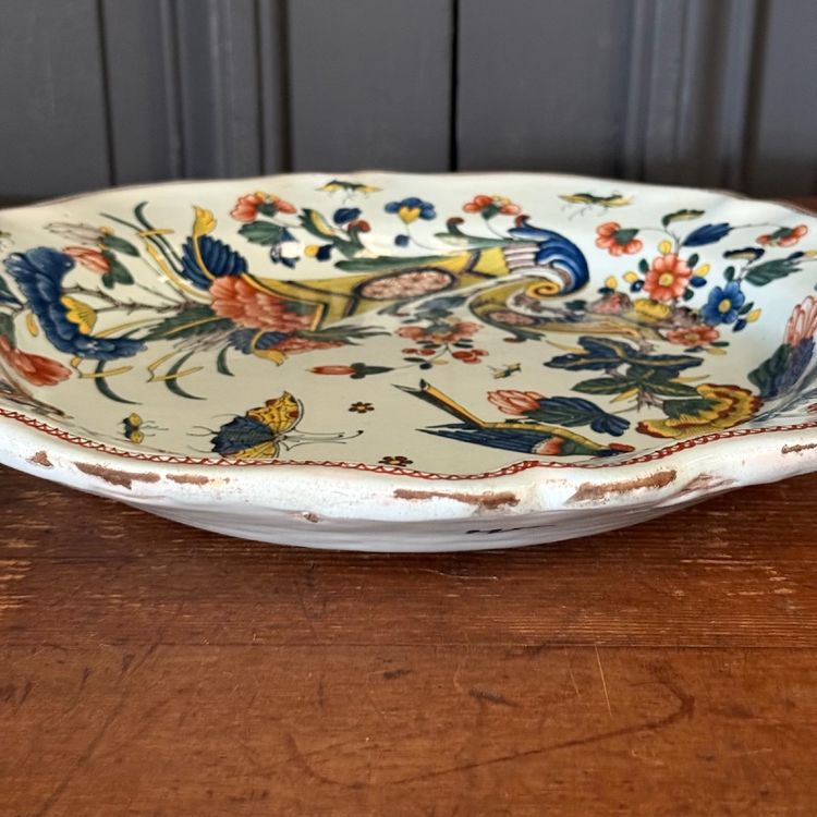 Large dish in Rouen earthenware, polychrome cornucopia 18th century
