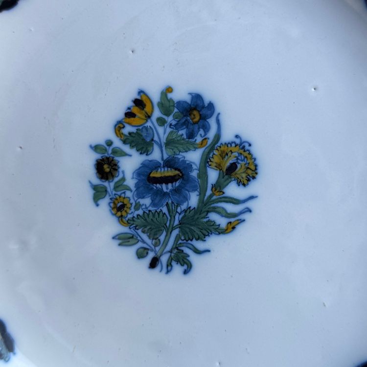 Plate in 18th century Moustiers earthenware with floral design