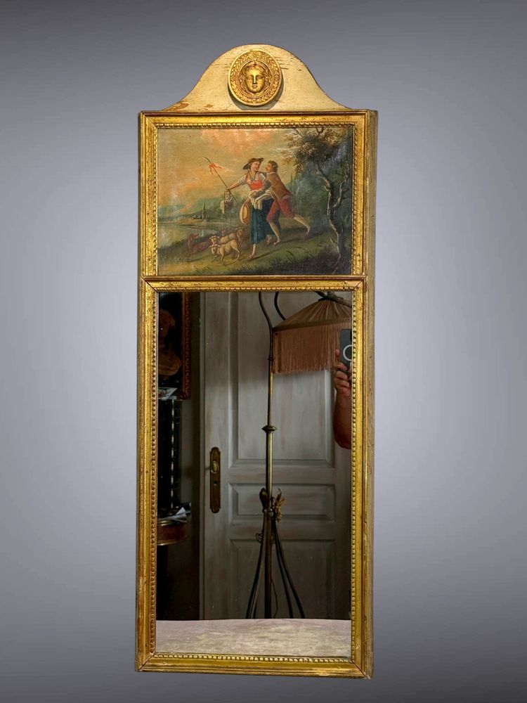 19th CENTURY EMPIRE STYLE LAMQUED AND GILDED WOOD TRUMP WITH A SHEPHERD DECORATIVE