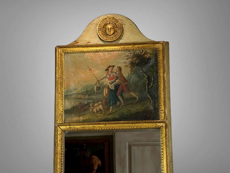 19th CENTURY EMPIRE STYLE LAMQUED AND GILDED WOOD TRUMP WITH A SHEPHERD DECORATIVE