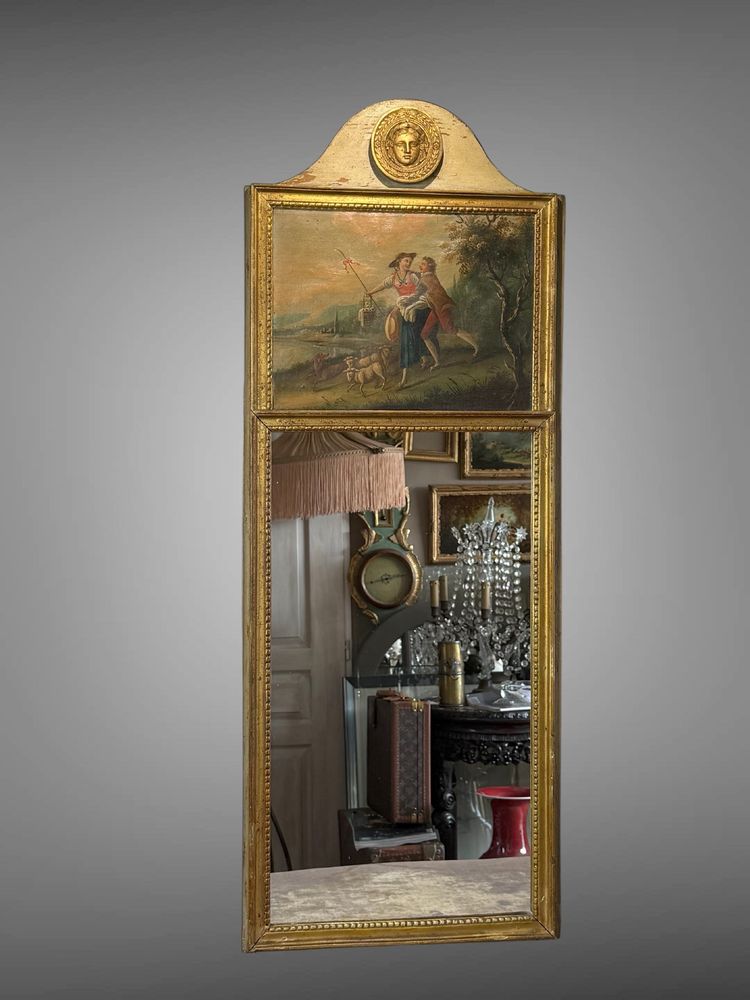 19th CENTURY EMPIRE STYLE LAMQUED AND GILDED WOOD TRUMP WITH A SHEPHERD DECORATIVE