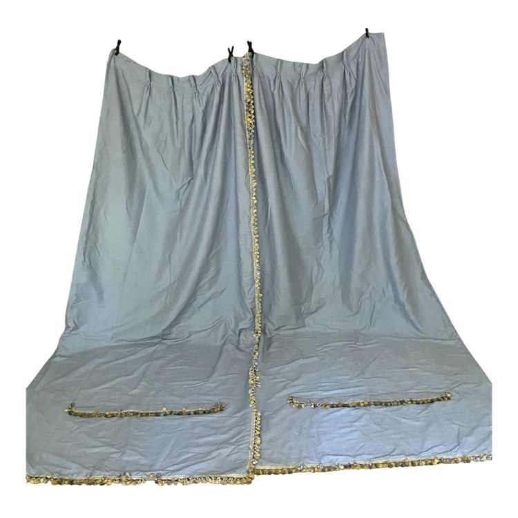 Second pair of sky blue cotton and silk curtains with decorative braces