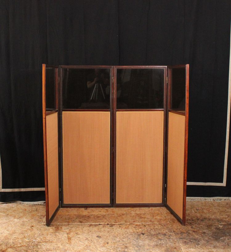 - Louis XVI-style four-leaf folding screen in carved and mahogany-stained beech. Work