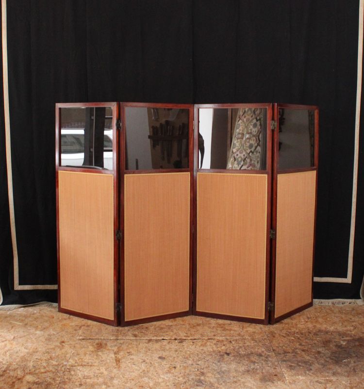 - Louis XVI-style four-leaf folding screen in carved and mahogany-stained beech. Work