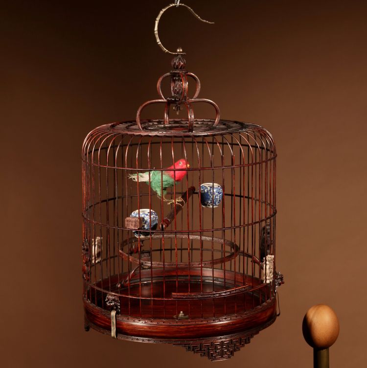 Chinese birdcage in finely carved bamboo.