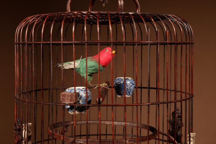Chinese birdcage in finely carved bamboo.
