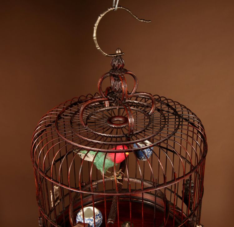 Chinese birdcage in finely carved bamboo.