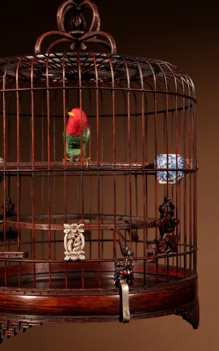 Chinese birdcage in finely carved bamboo.
