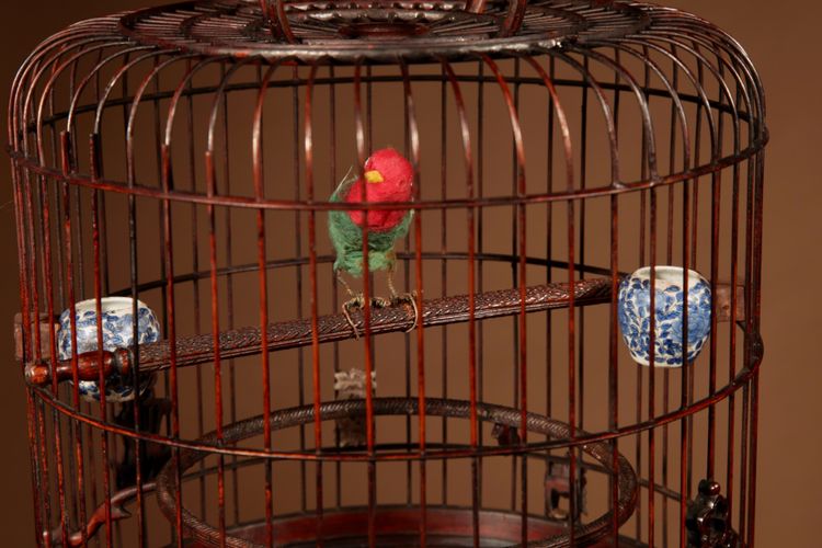 Chinese birdcage in finely carved bamboo.