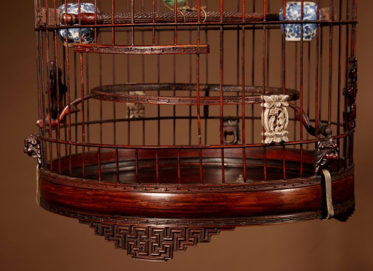 Chinese birdcage in finely carved bamboo.