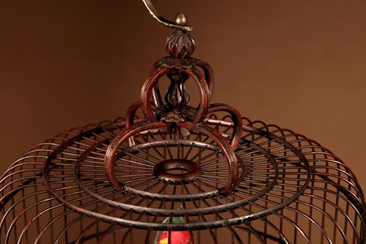 Chinese birdcage in finely carved bamboo.