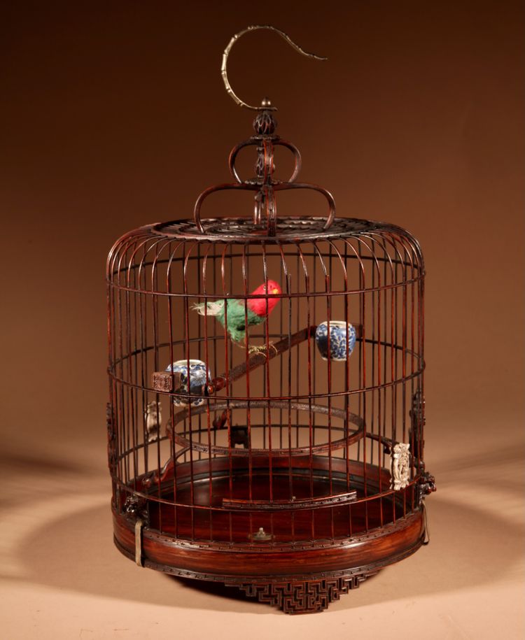 Chinese birdcage in finely carved bamboo.