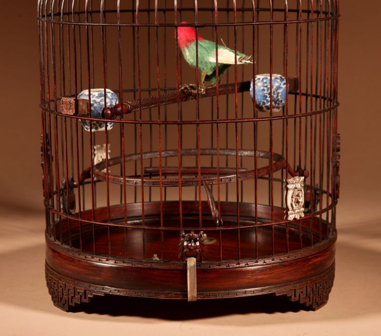 Chinese birdcage in finely carved bamboo.