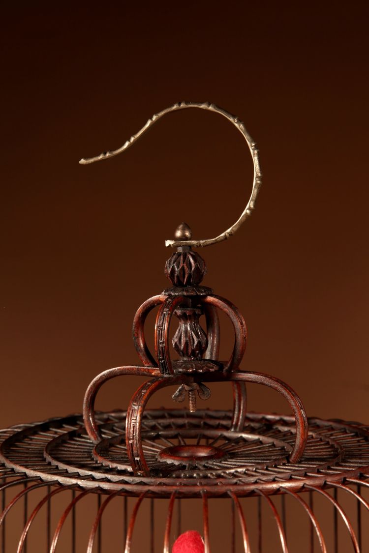 Chinese birdcage in finely carved bamboo.