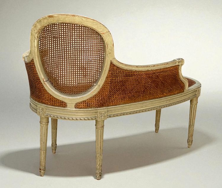 1900S LOUIS XVI STYLE CANED BENCH IN PATINATED WOOD