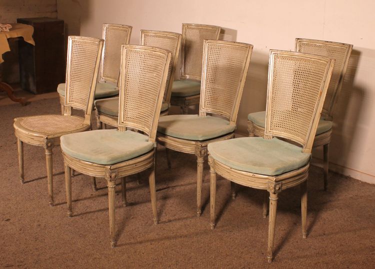 suite de 12 chaises de style Louis XVI en bois polychrome -19° siècle