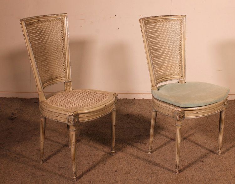 suite de 12 chaises de style Louis XVI en bois polychrome -19° siècle