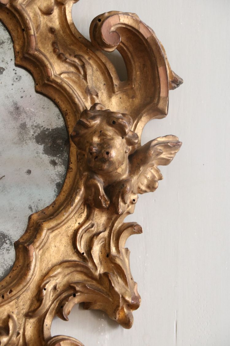 Miroir italien Louis XV en bois sculpté et doré