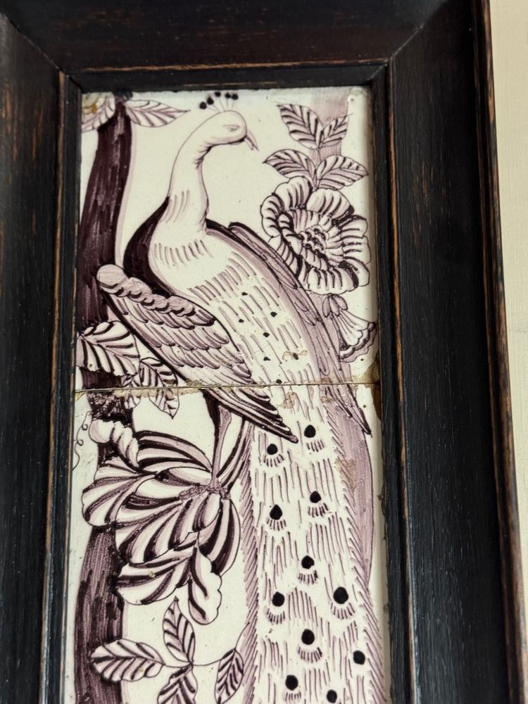 Three manganese Delft tiles forming a portrait of a peacock, 18th century