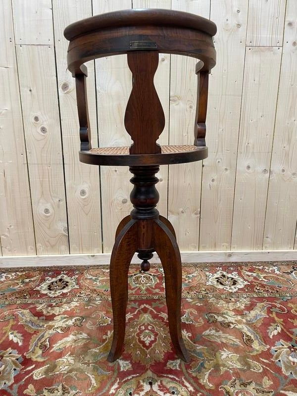 Fauteuil de coiffeur en cannnage Paul Tournay