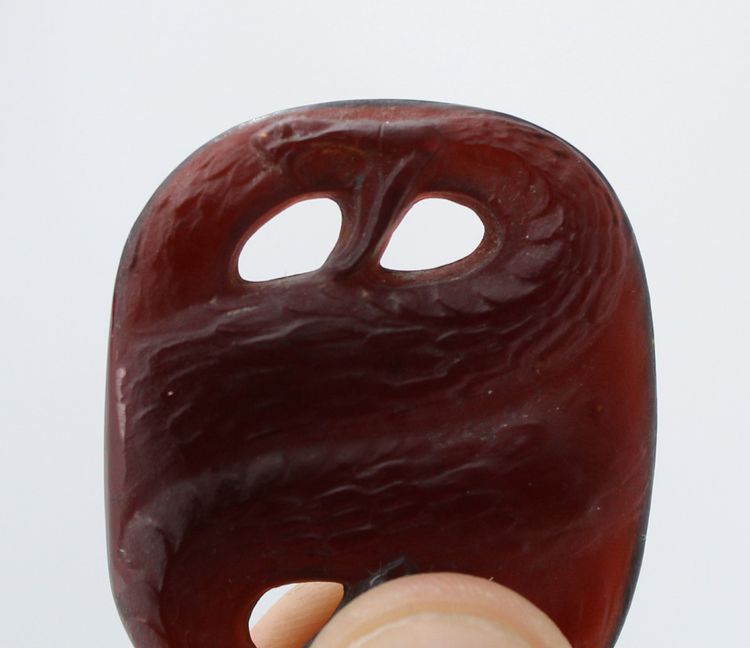 "Serpents" pendant signed R Lalique in brown glass