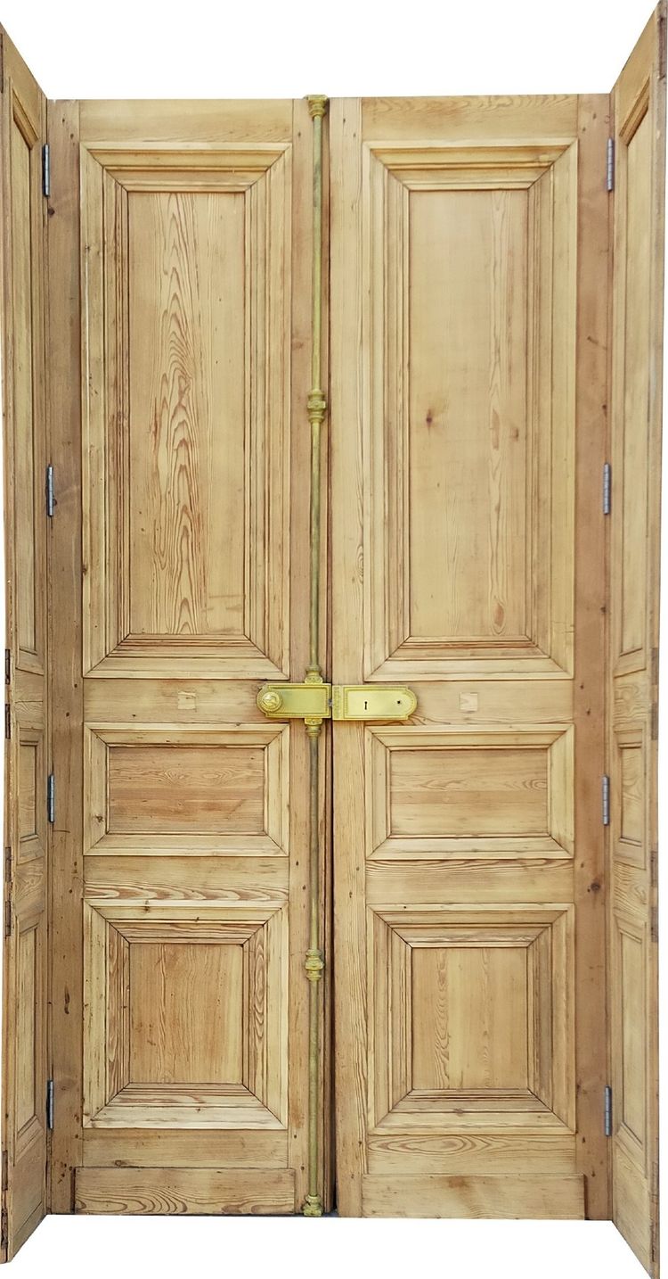 Two antique double doors from the Empire period with their woodwork frames