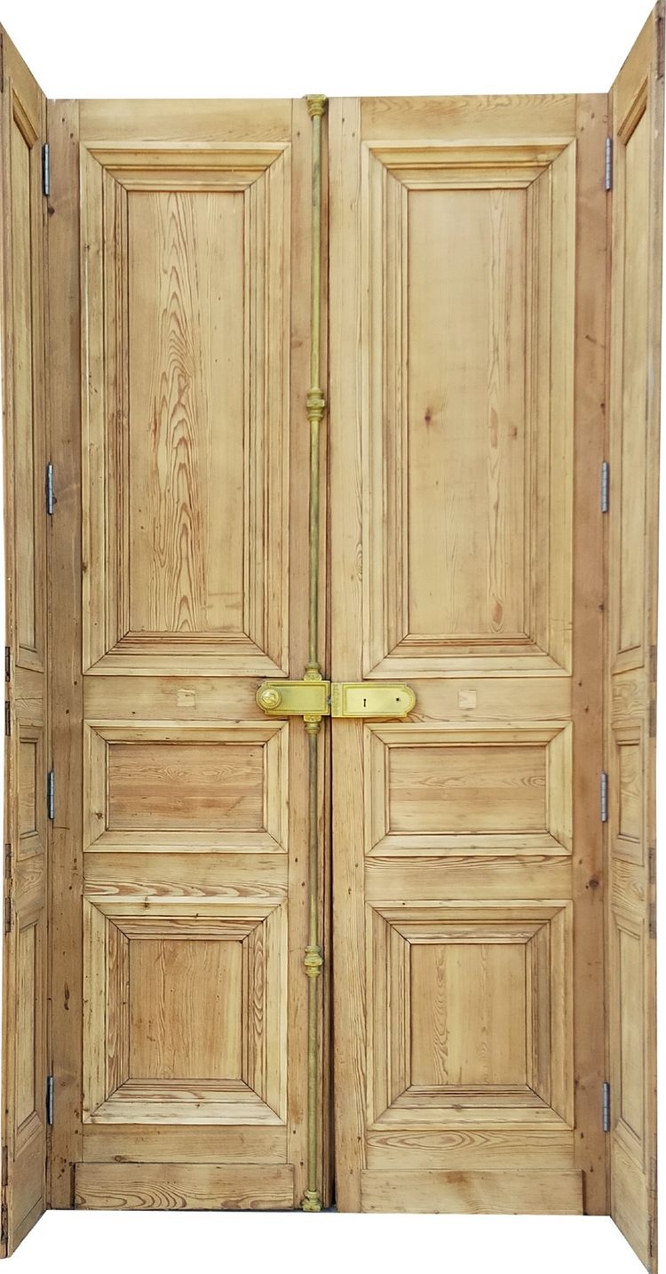 Two antique double doors from the Empire period with their woodwork frames