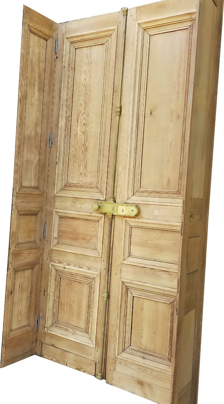 Two antique double doors from the Empire period with their woodwork frames