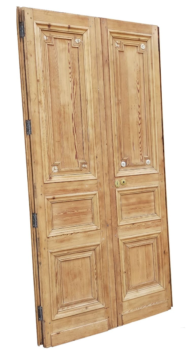 Two antique double doors from the Empire period with their woodwork frames