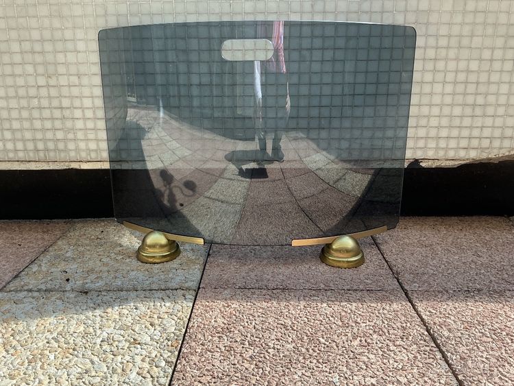 Modernist smoked and curved glass firewall circa 1970