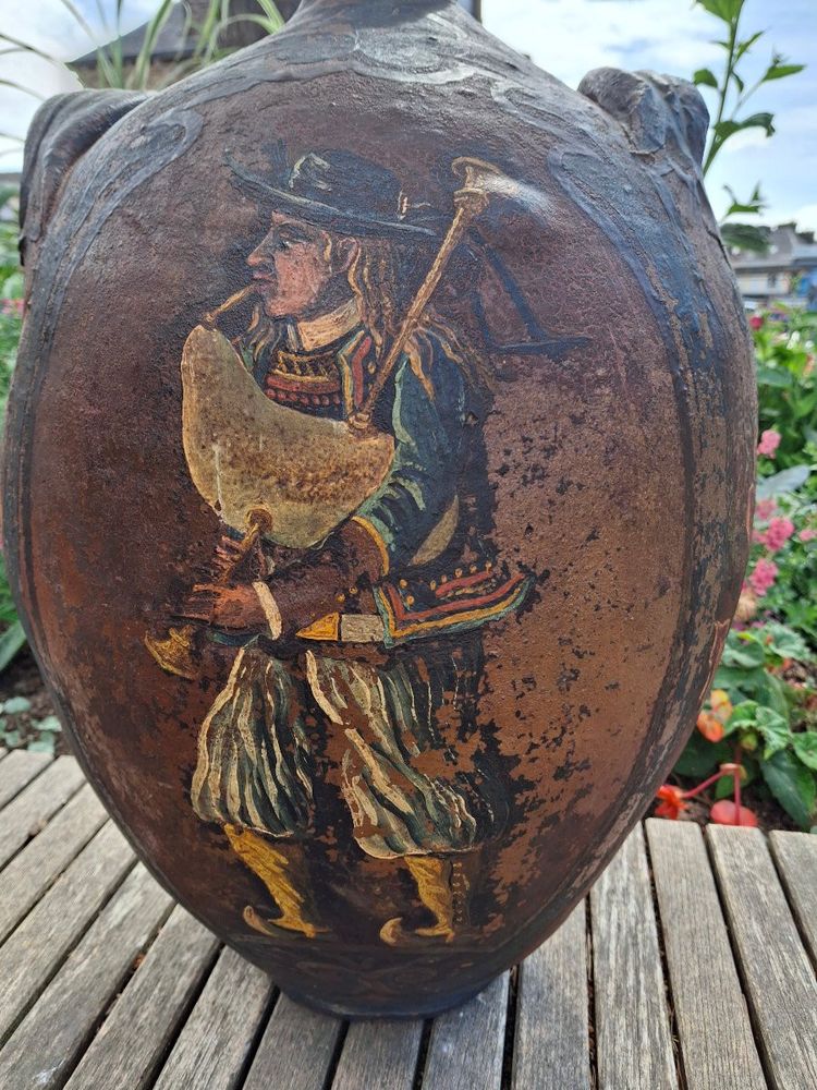 Breton folk art bagpipe player