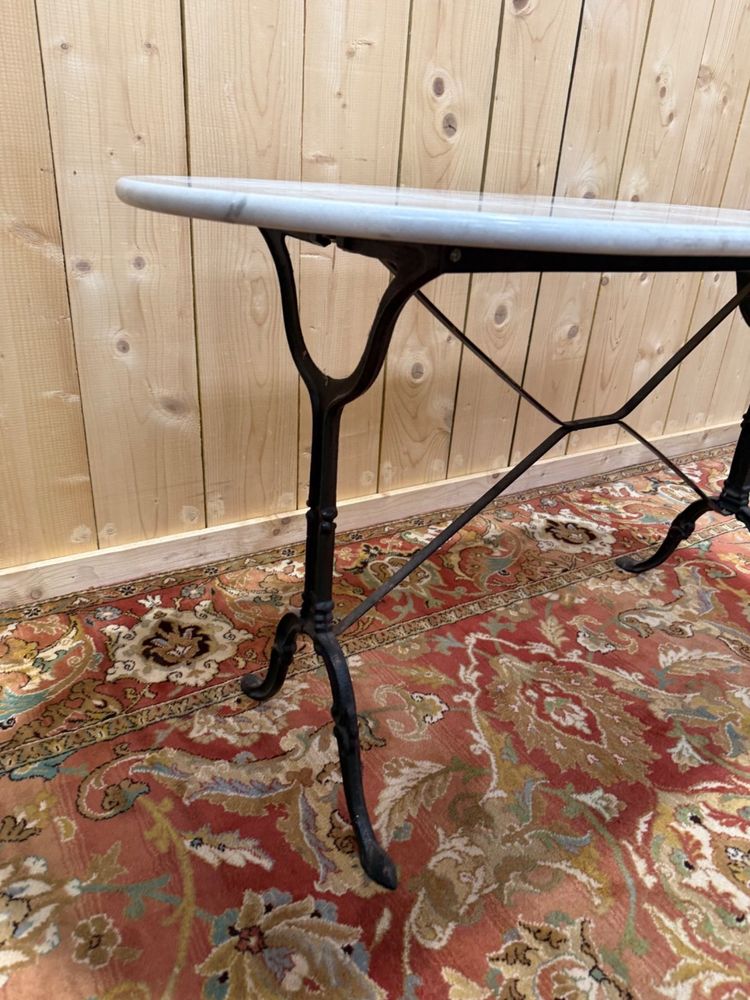 Oval marble and cast iron bistro table