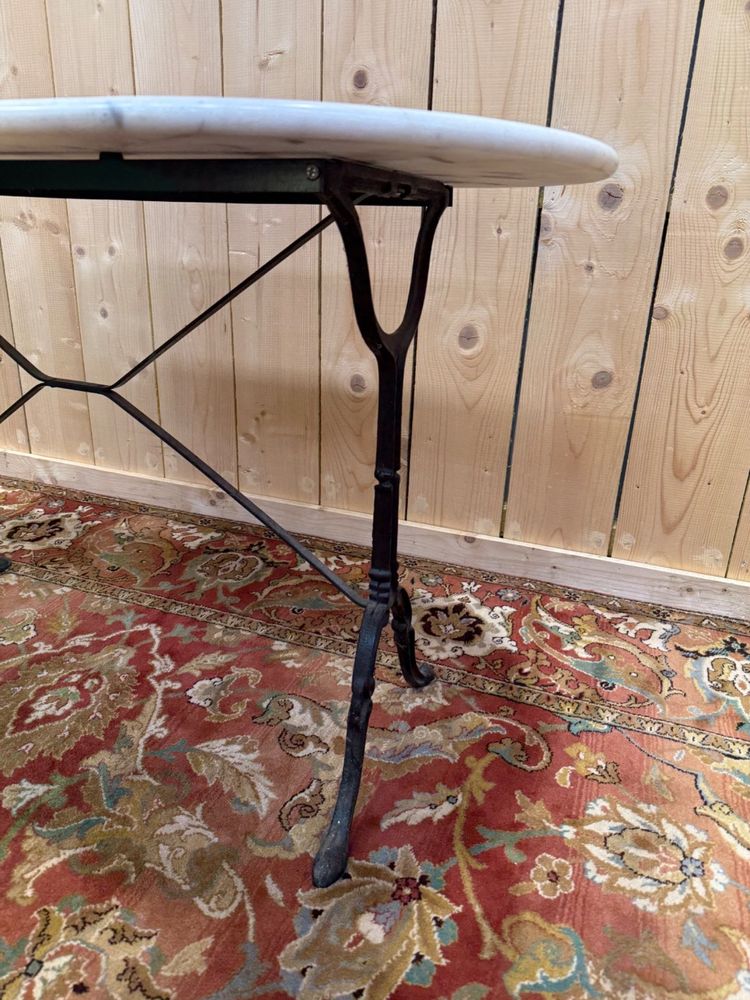Oval marble and cast iron bistro table
