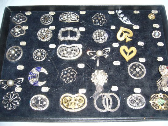 Box of decorative buckles from the early 20th century