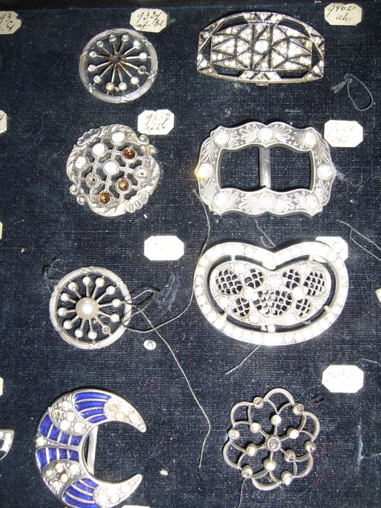 Box of decorative buckles from the early 20th century