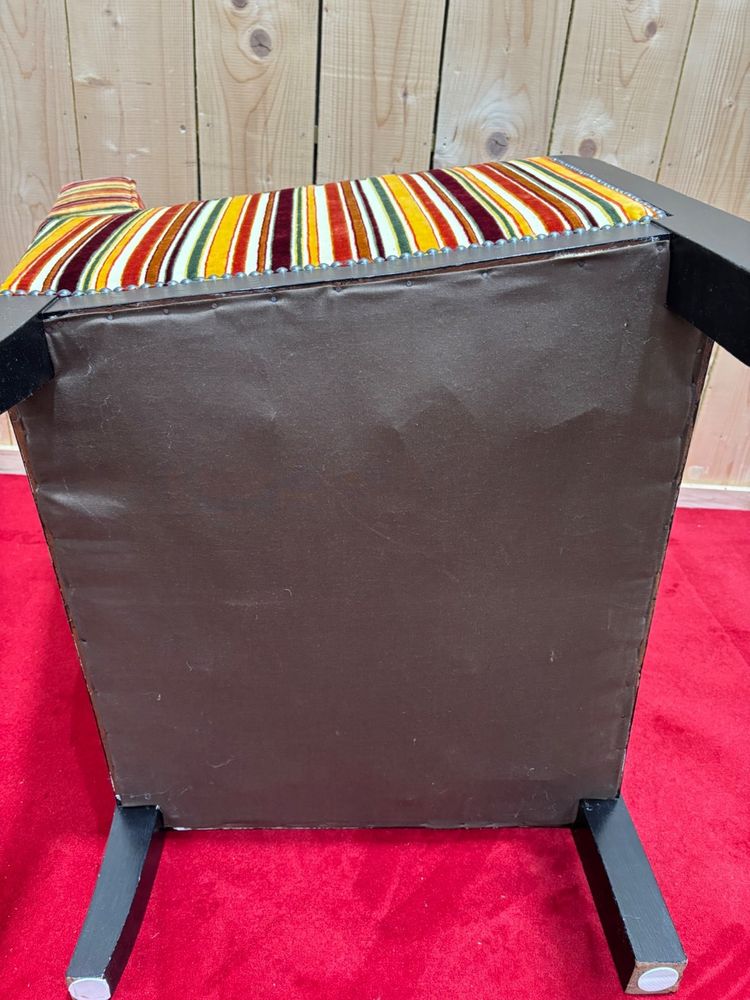 Art deco armchair in multicolored striped fabric