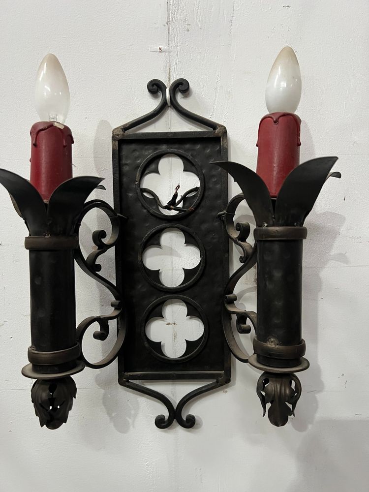 Set of three Renaissance-style wrought iron wall sconces, 20th century