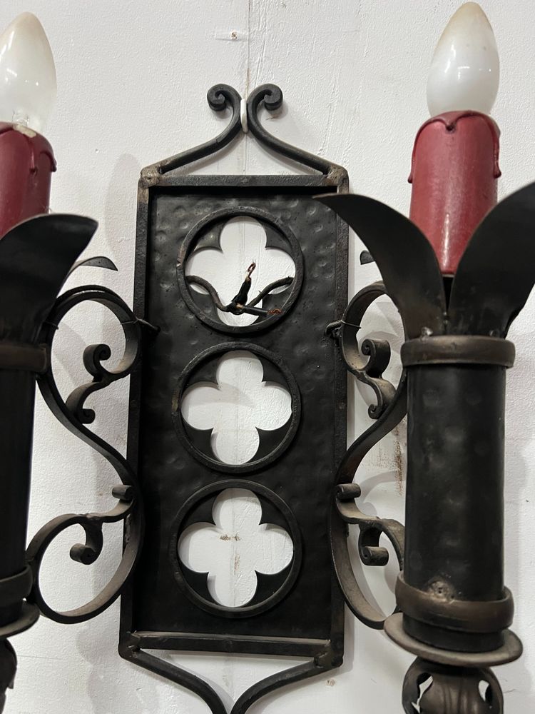 Set of three Renaissance-style wrought iron wall sconces, 20th century