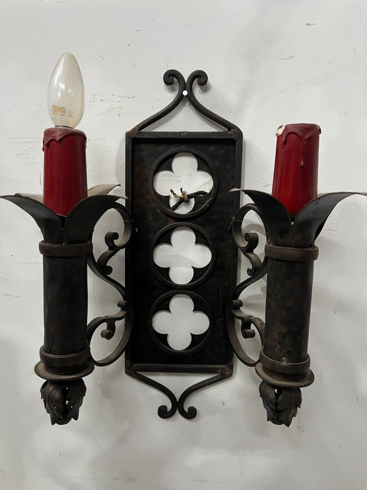 Set of three Renaissance-style wrought iron wall sconces, 20th century