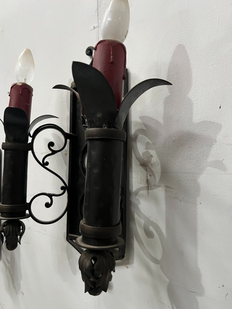 Set of three Renaissance-style wrought iron wall sconces, 20th century