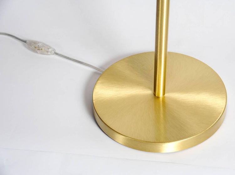 Satin brass table lamp with round white glass globe