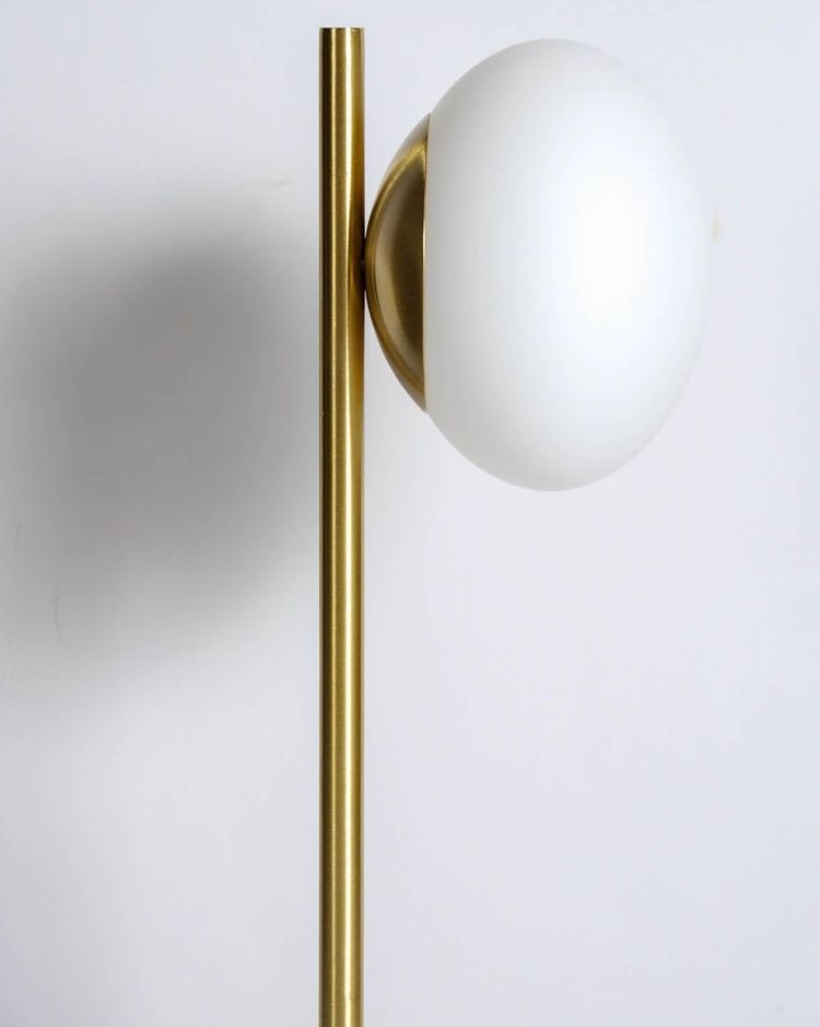 Satin brass table lamp with round white glass globe