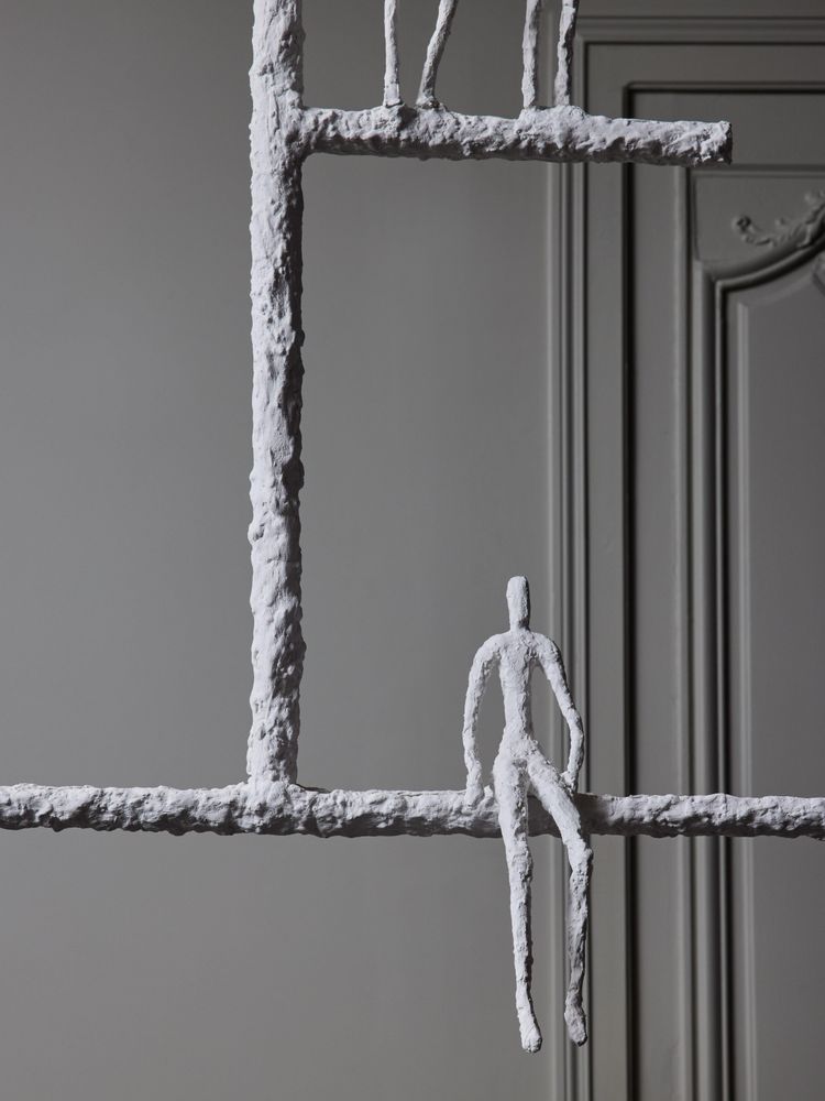 Linear chandelier with characters from Glustin Luminaires