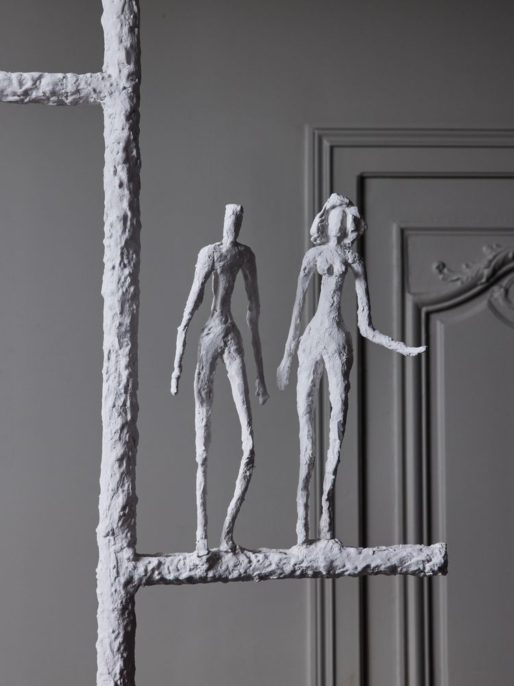 Linear chandelier with characters from Glustin Luminaires