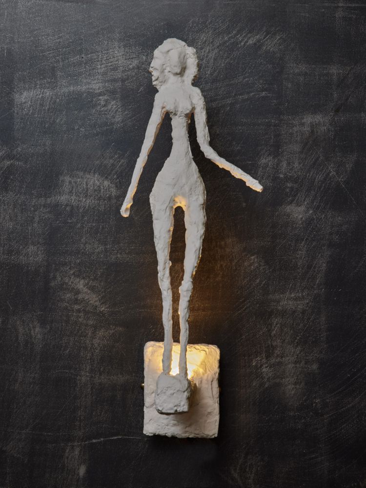 Wall lights with plaster characters from Glustin Luminaires