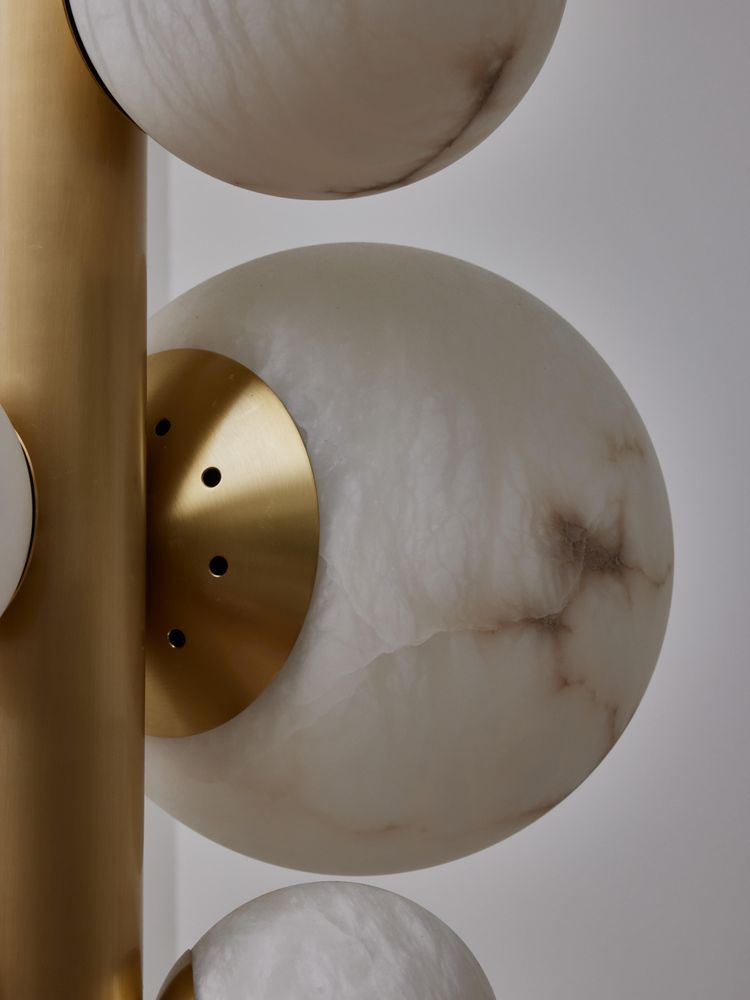 Vertical brass chandelier with alabaster globes
