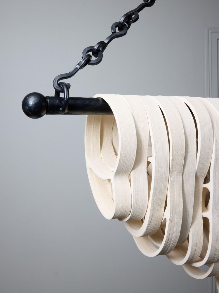 Long iron and ceramic chandelier by Olivia Cognet