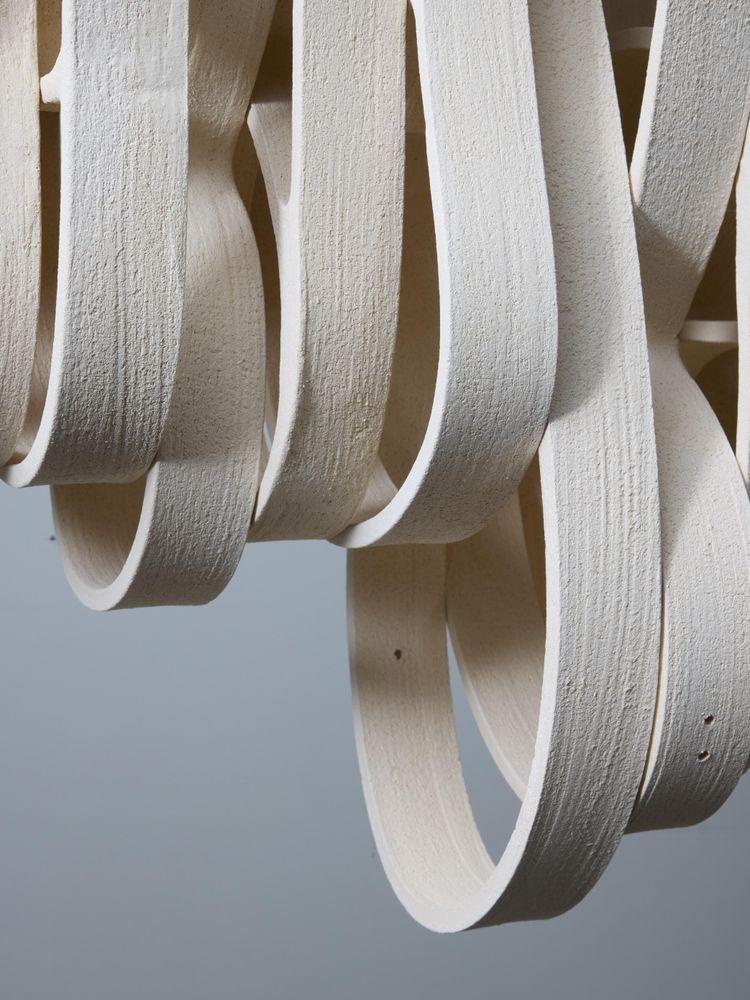 Long iron and ceramic chandelier by Olivia Cognet